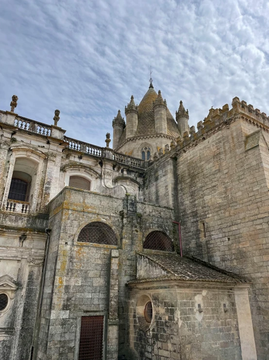 a stone and stucco building has a clock tower