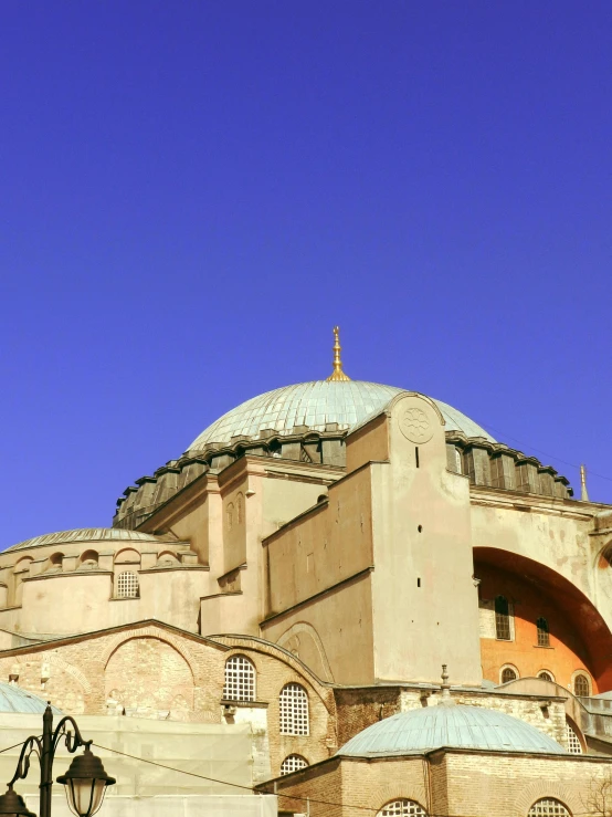 a tall building with lots of arches and domes