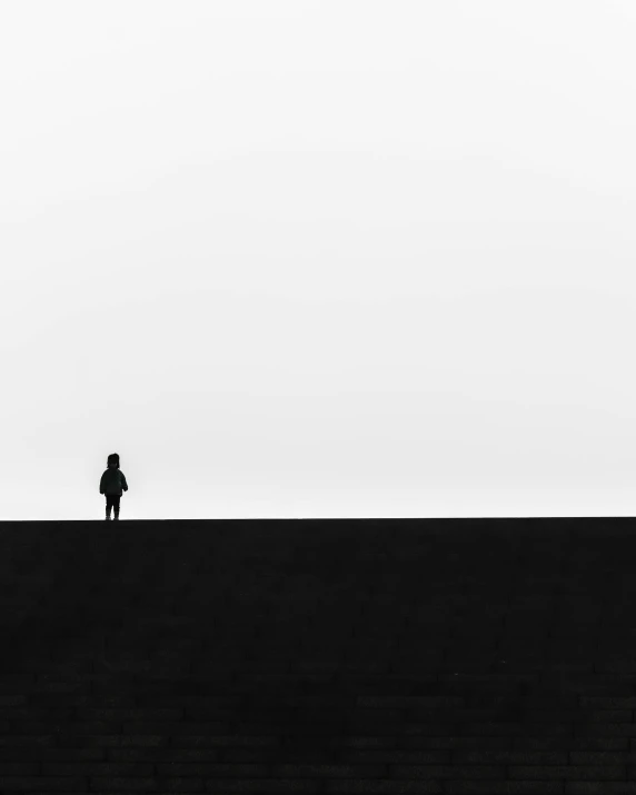 a man on a large hill standing up