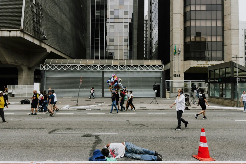 a man that is laying down in the street