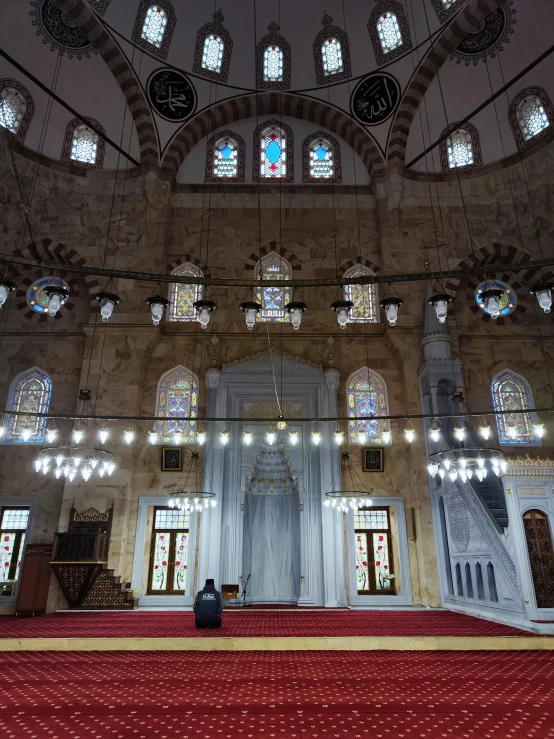 the interior of a large church with windows and carpet