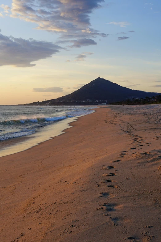 a beach area with a surf boarder on it's side