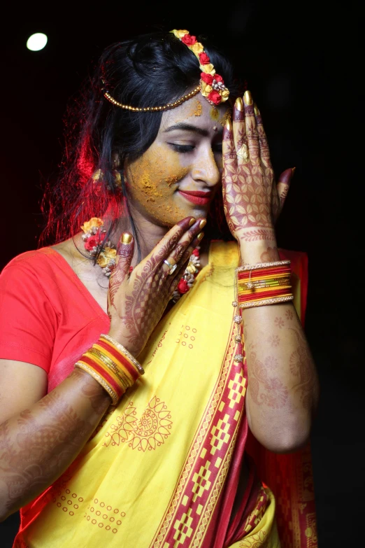 the bride has all bright colors on her face and hands