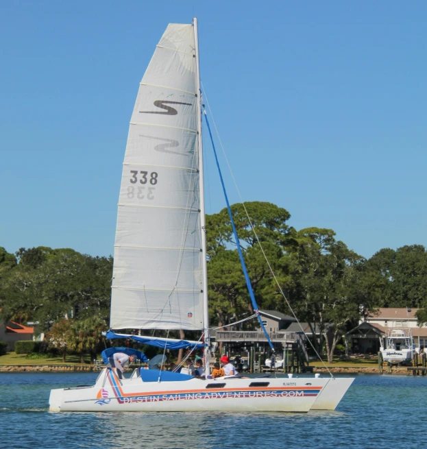 a boat is sailing in the water near trees