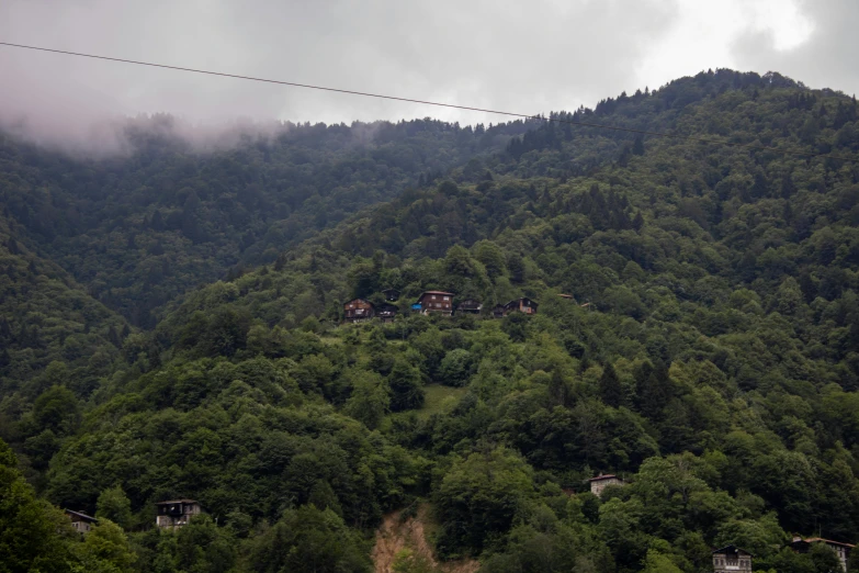 a bunch of houses that are on top of a hill