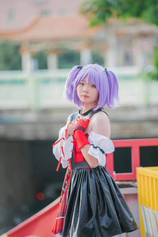 girl in a red dress and a purple wig posing