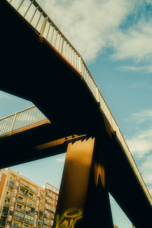 a tall metal bridge with some writing on it