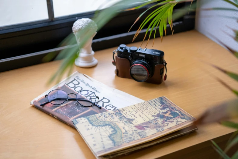 a book is open with glasses on top