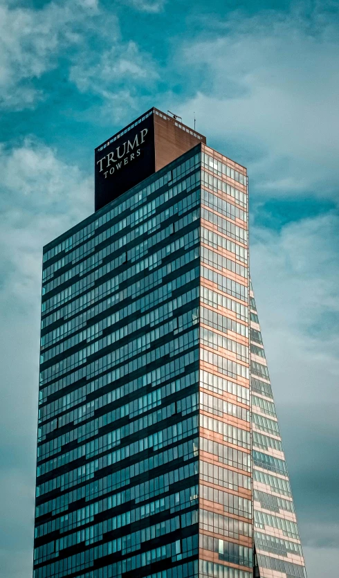 the top of a large building, with the word x on it