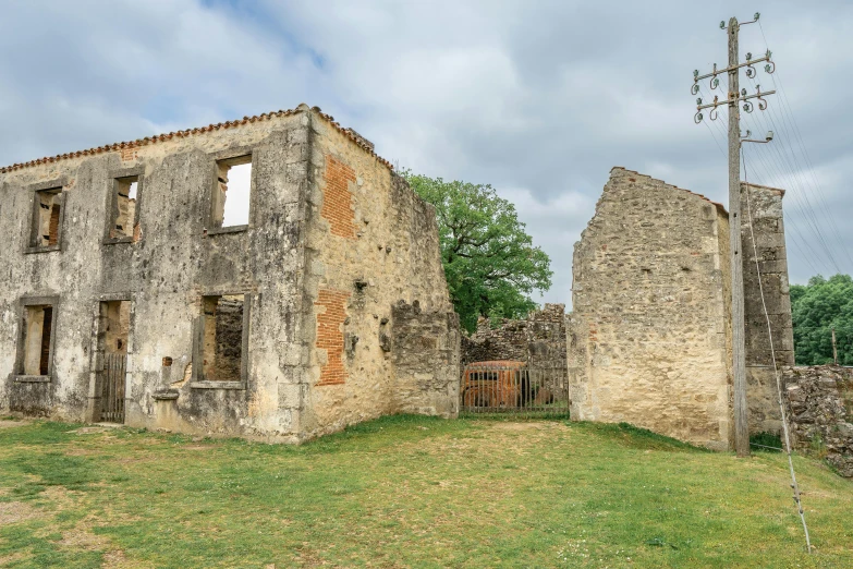 an old ruined house and antenna is on a hill