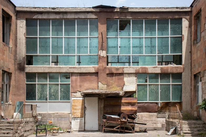 an old run down building with multiple windows