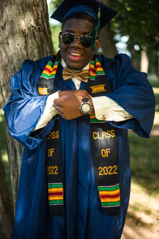 an image of a black man in graduation cap and gown