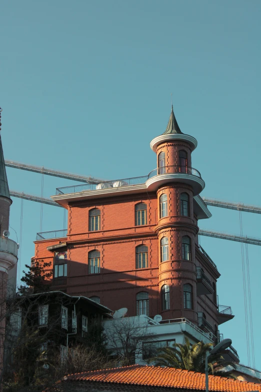 a po taken of a building from below a cable