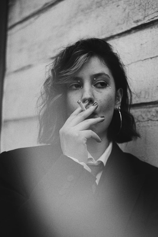 black and white po of a woman smoking