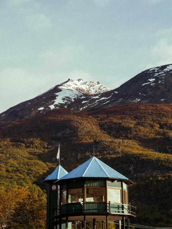 a house sits on the side of a hill