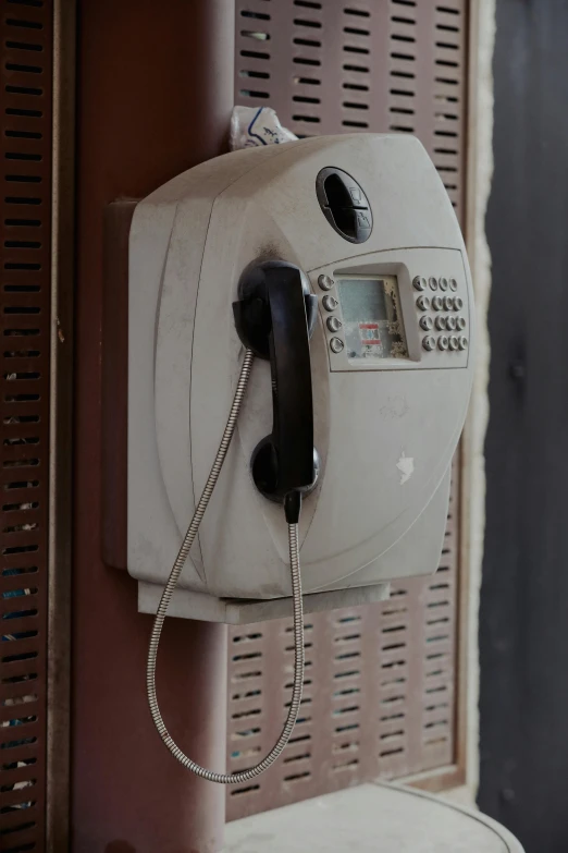 a payphone in a cell phone booth