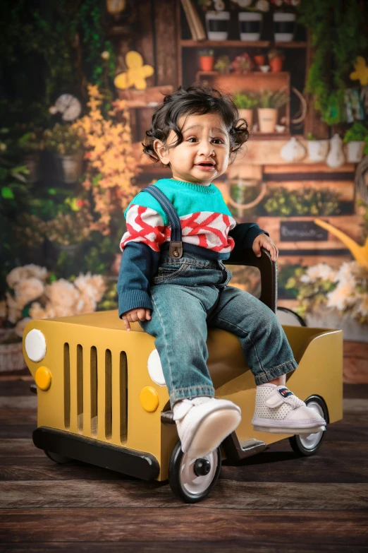 a boy sitting in the back of a dump truck