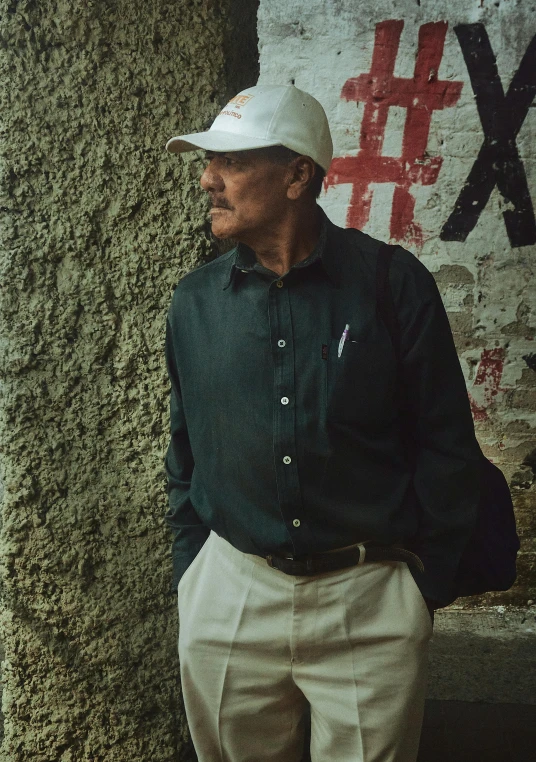 an old man is wearing a baseball cap