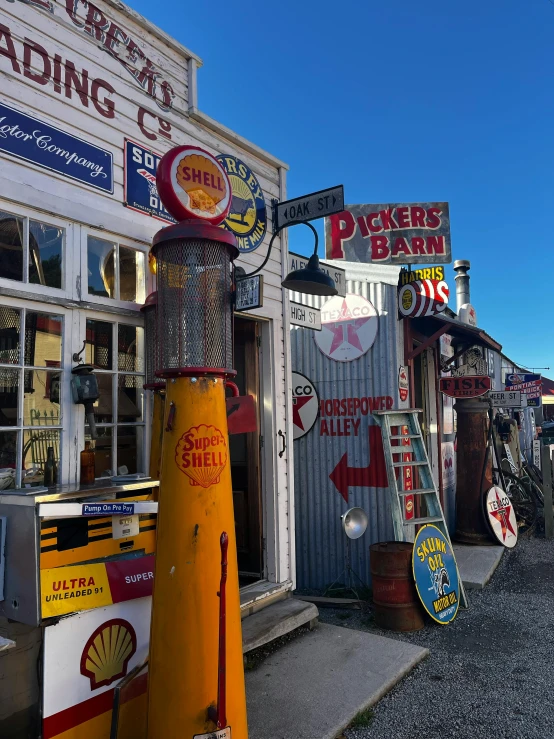 signs and traffic signals in front of an old run down fast food store