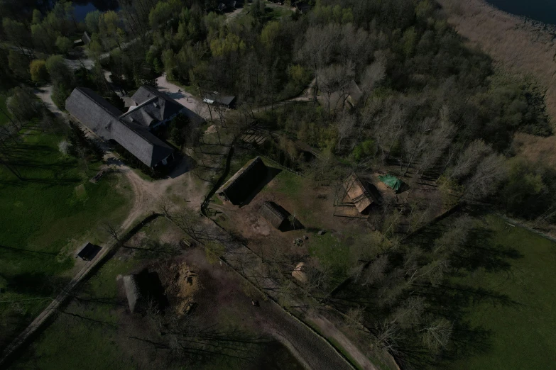 an aerial s of a house, with lots of trees