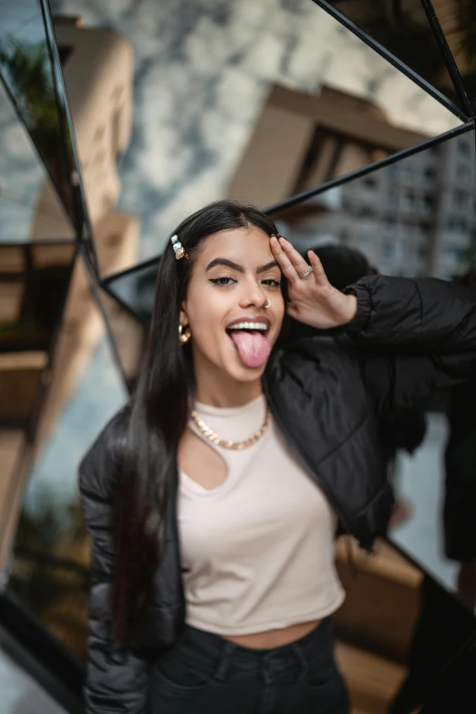 smiling  in front of mirror holding black umbrella