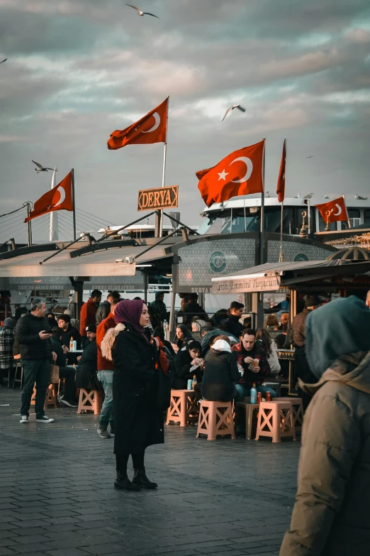 many people are gathered outside to enjoy a meal