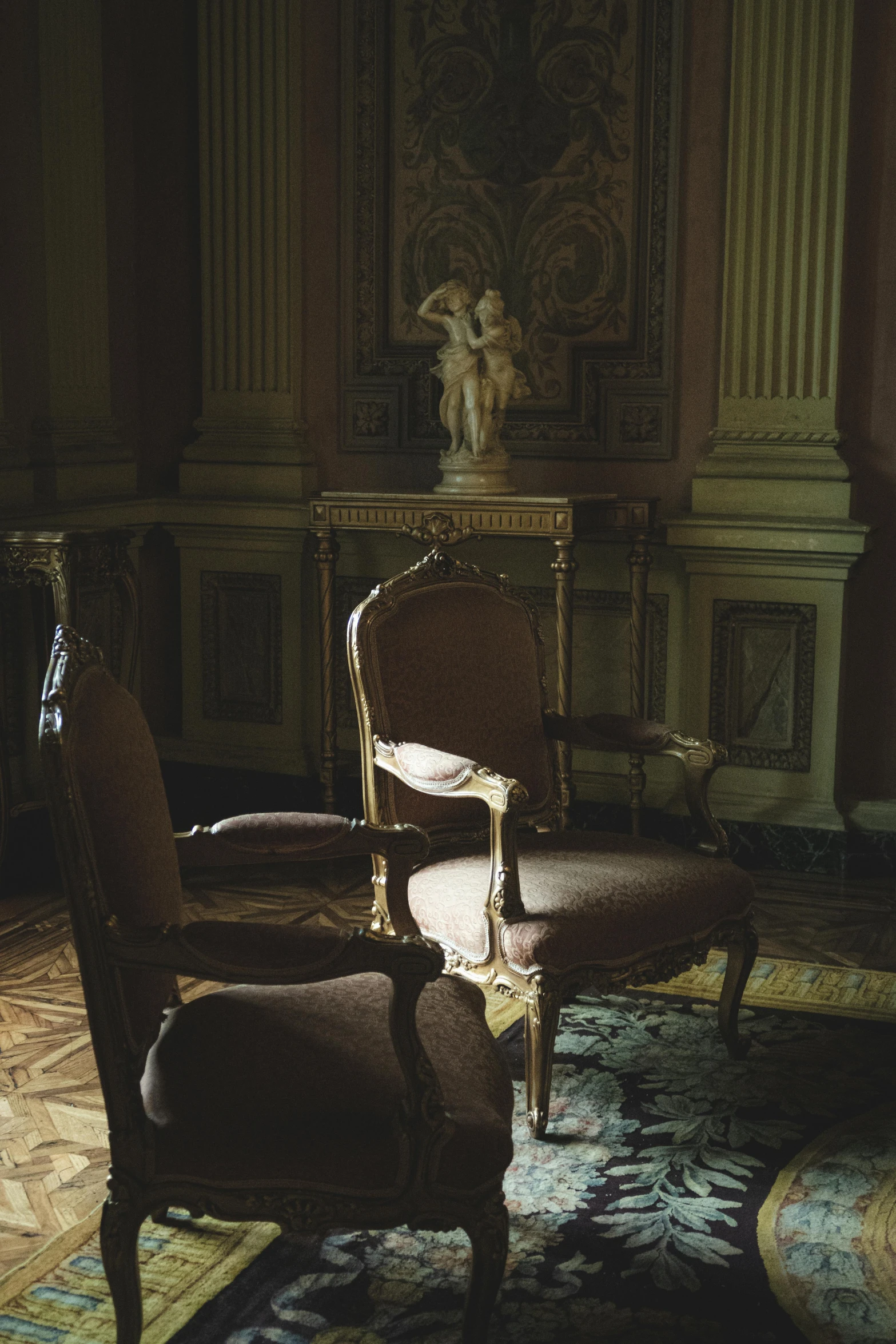 a fancy antique living room with dark color