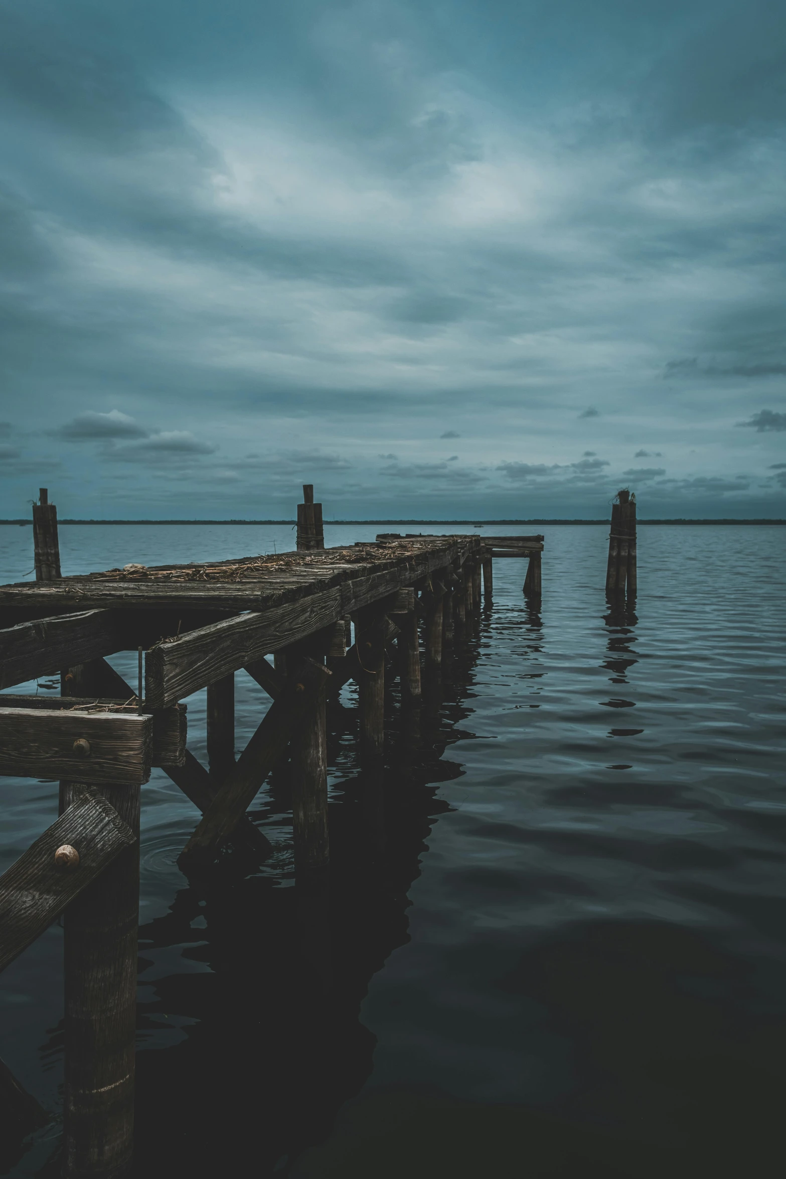 a body of water with a dock in the middle