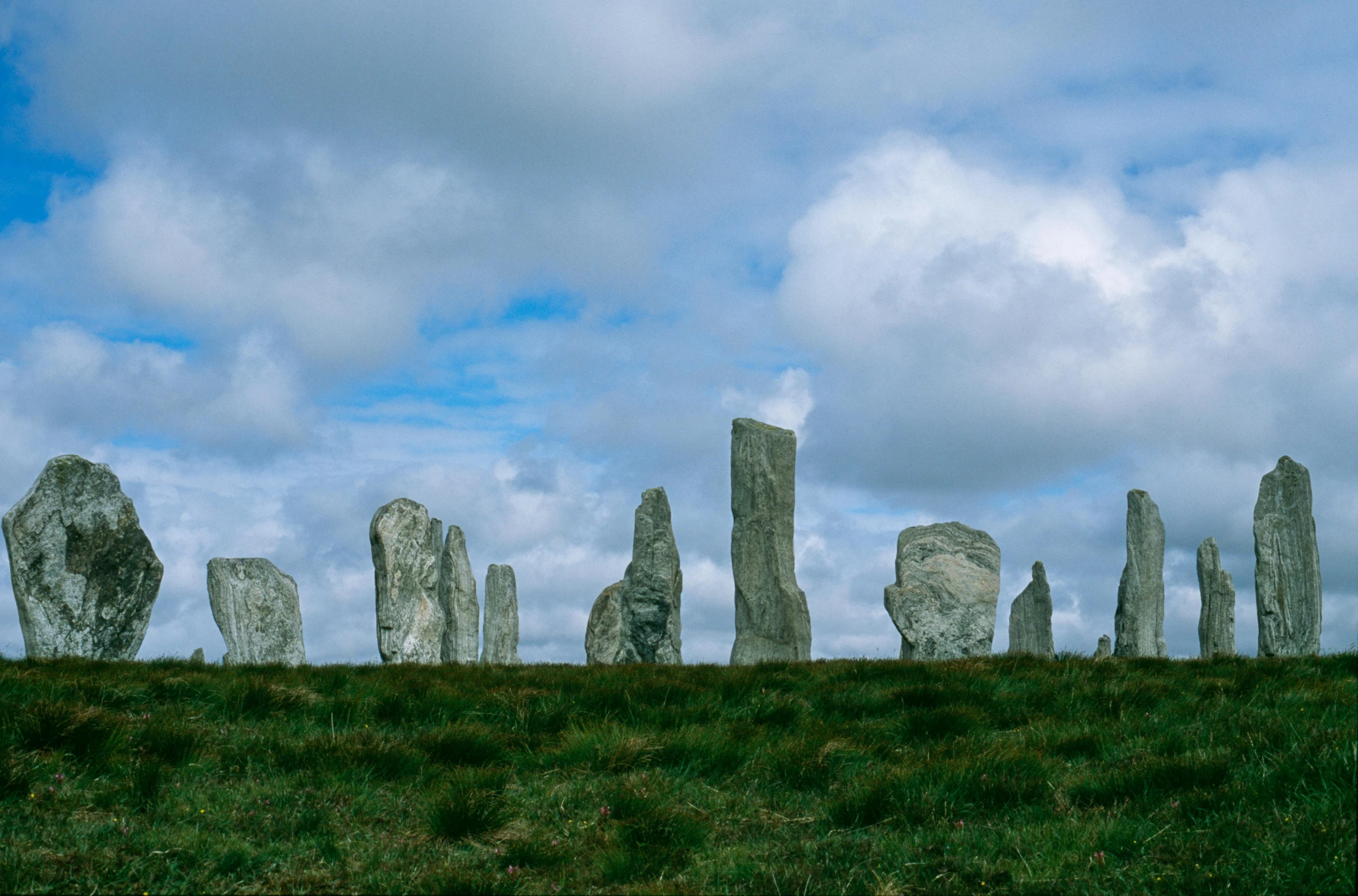 the stones of callanite standing on a grassy hillside