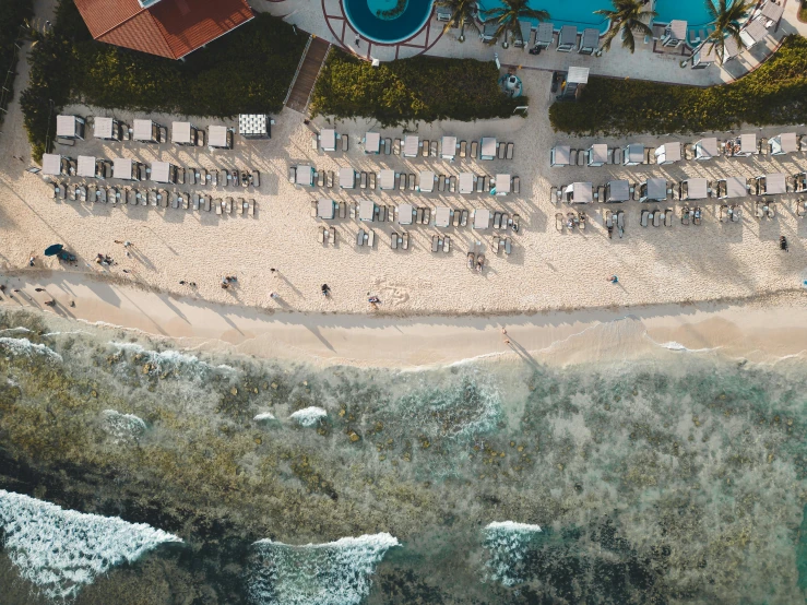 an aerial s of an outdoor area with umbrellas and lawn chairs