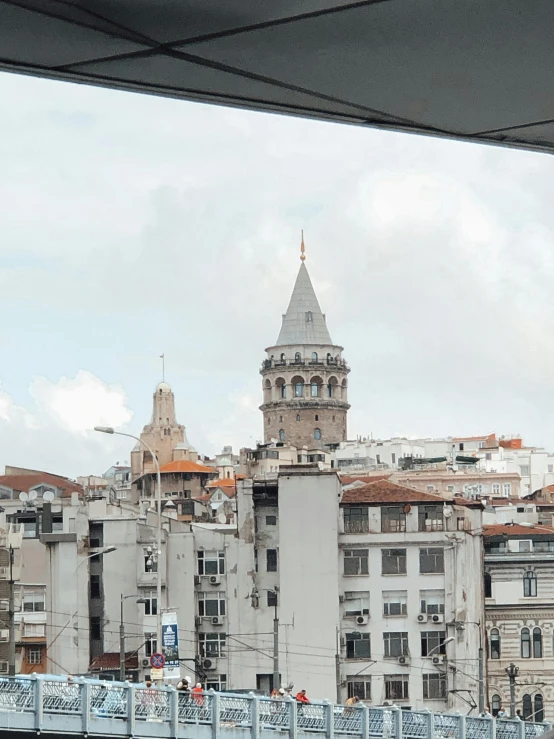 view of city skyline with blue bridge and clock tower