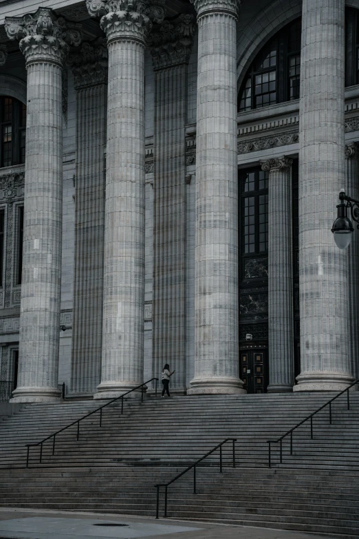 the steps are lined up next to two tall columns