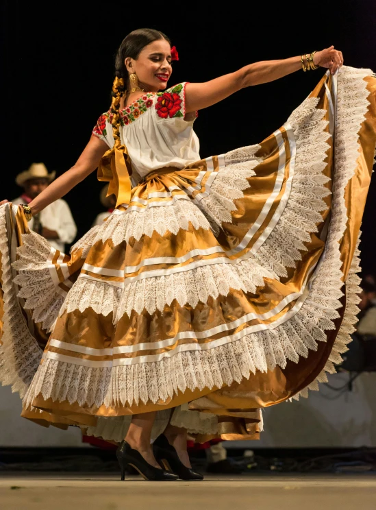 woman in an elegant dress holding a flower on the skirt