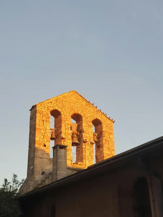 two large structures sit atop a roof in the sun