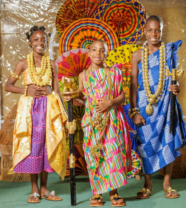 the three girls are posing in native clothing