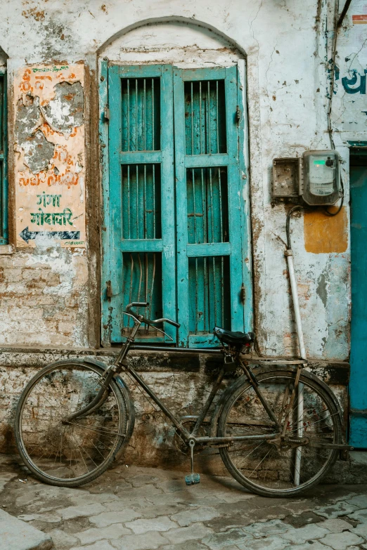 a bicycle parked in front of a building