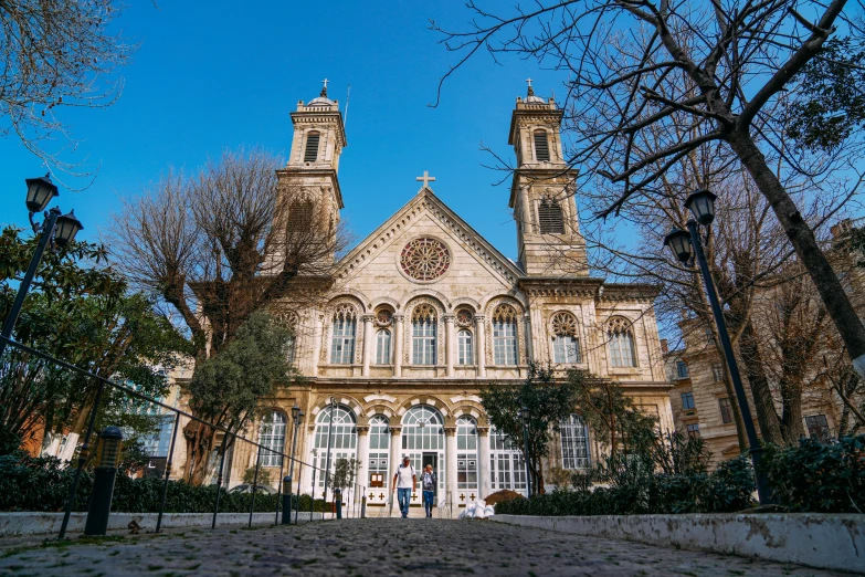 an ornate church building with two steeples on each side