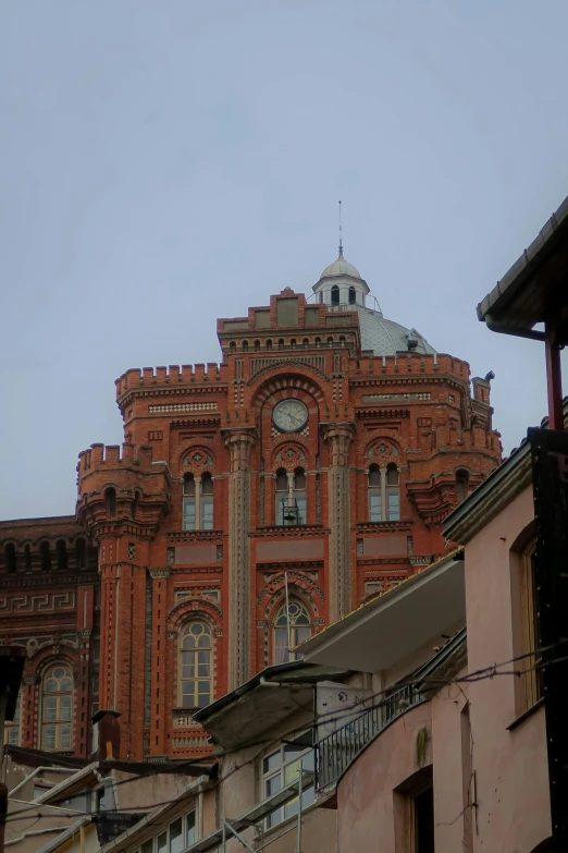 a large building has a clock tower on top of it