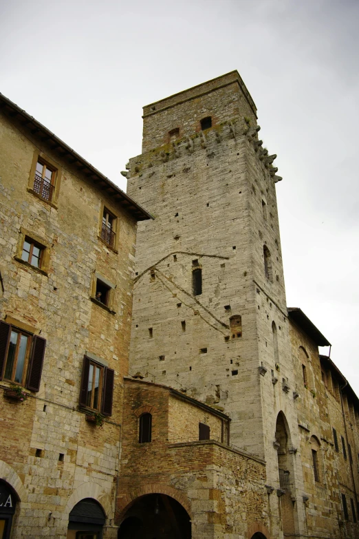 an old stone building with an interesting clock