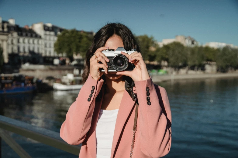 the  has her camera pointed at a river