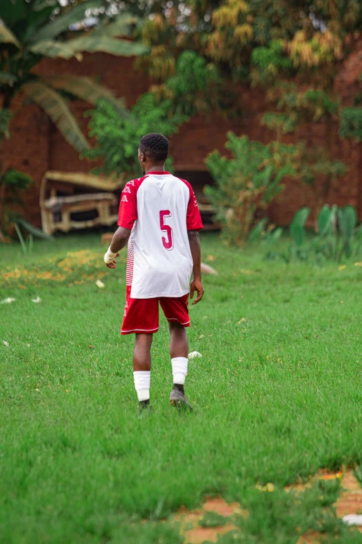 there is a young soccer player that is playing