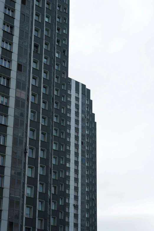 tall building with many windows on a cloudy day