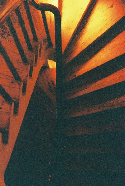 an up close po of a wooden slatted railing and floor