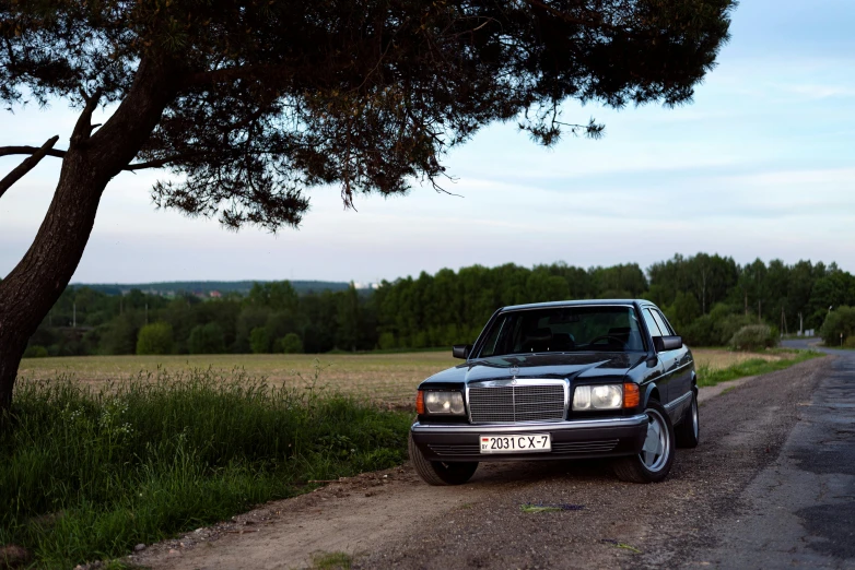 a mercedes benz parked on the side of the road