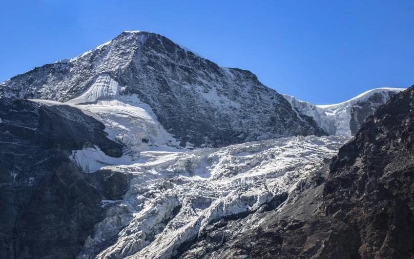 a mountain is shown with snow on it