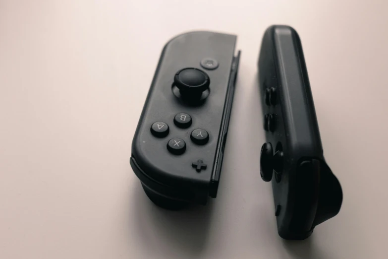 black controller is positioned close to each other