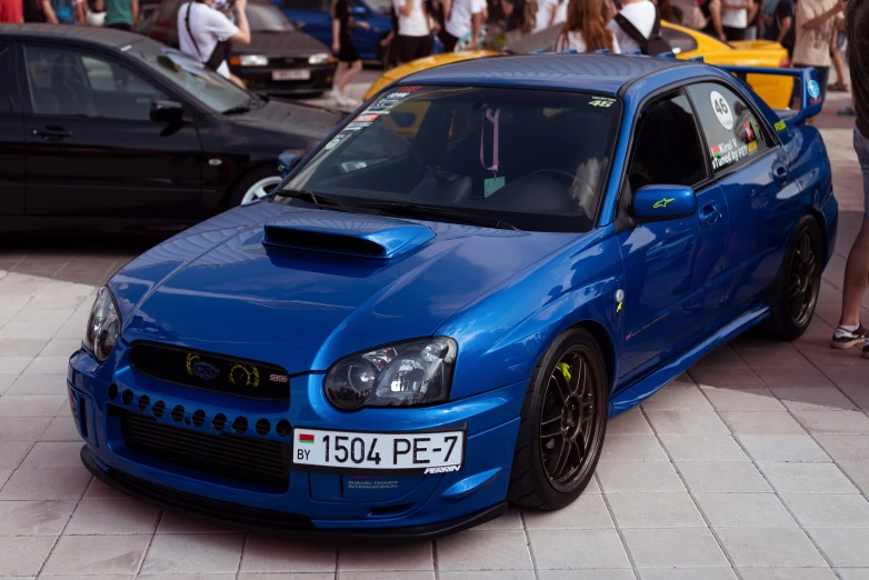 a subaru is on display at an automobile show
