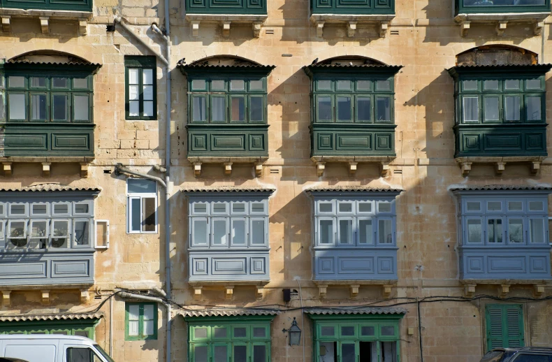 an old building with many shuttered windows