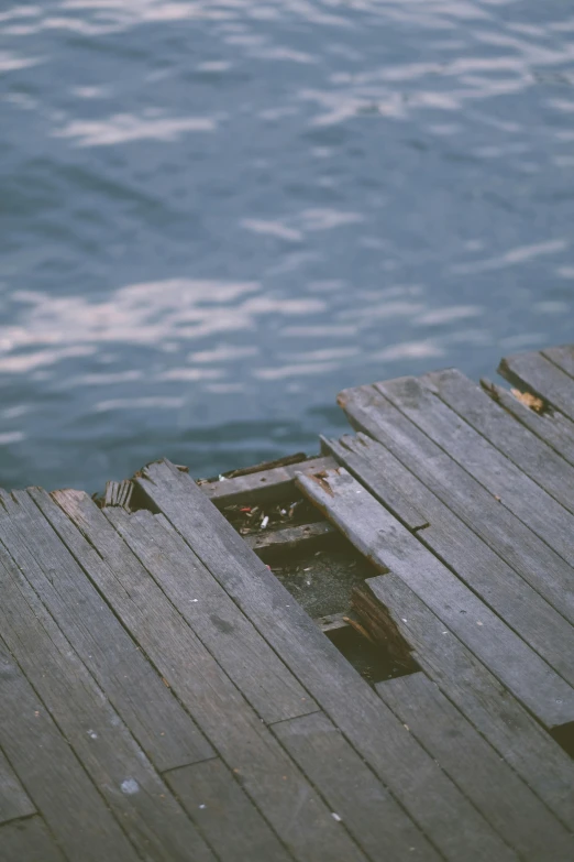 the boards of the pier are broken, some have been left