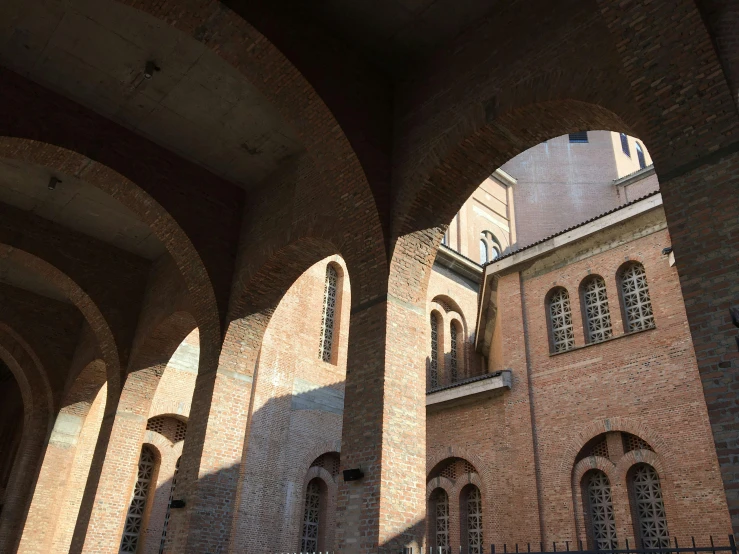 there are several arches on the inside of an old building